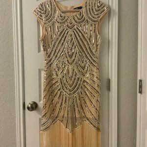 Gold and silver gown with tassels